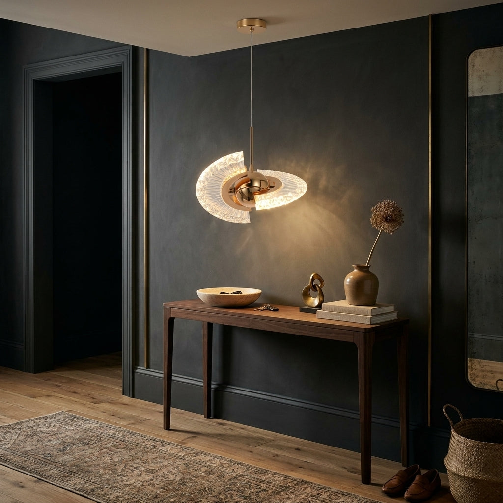 Gold crystal shell pendant light with warm white LED above a walnut console table in a dark entrance hall