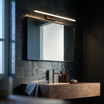 Slim LED Mirror Light 40 cm in matte black over a walnut vanity with dark zellige tiles