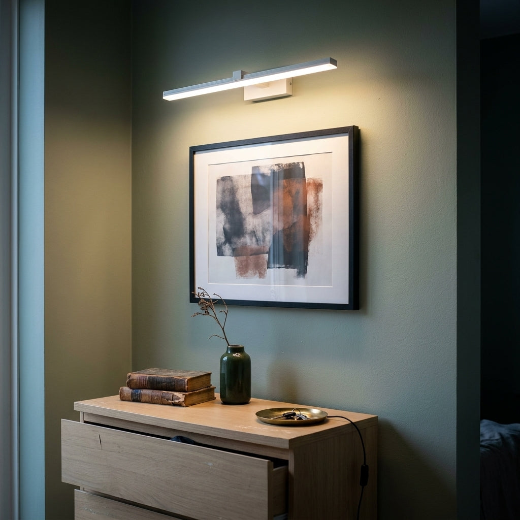 Slim LED Mirror Light 40 cm in matte white used as a picture light above a framed print